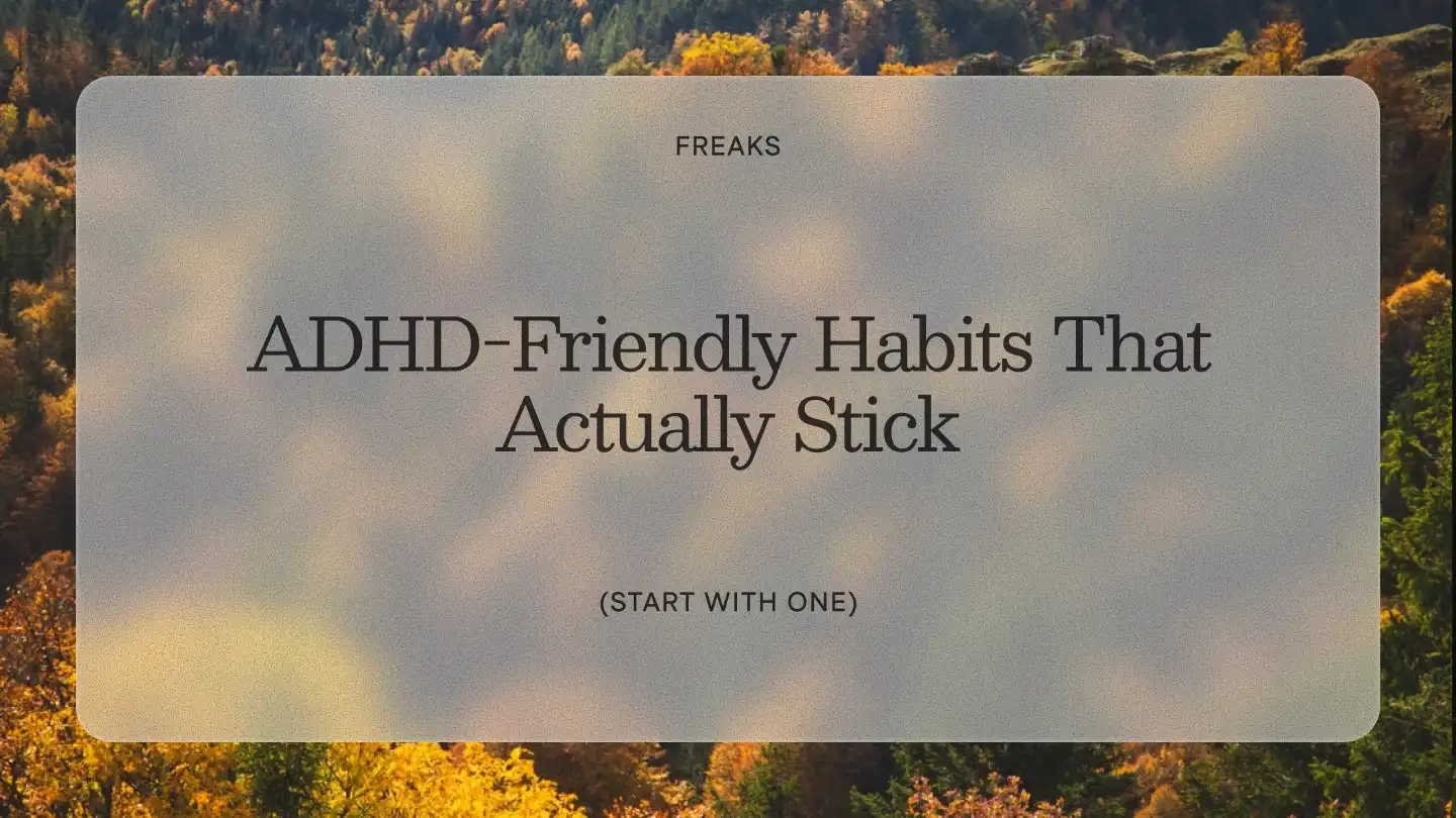 Freaks article title card reading 'ADHD-Friendly Habits That Actually Stick', with the subtitle 'Start with one', over an autumn forest seen from above