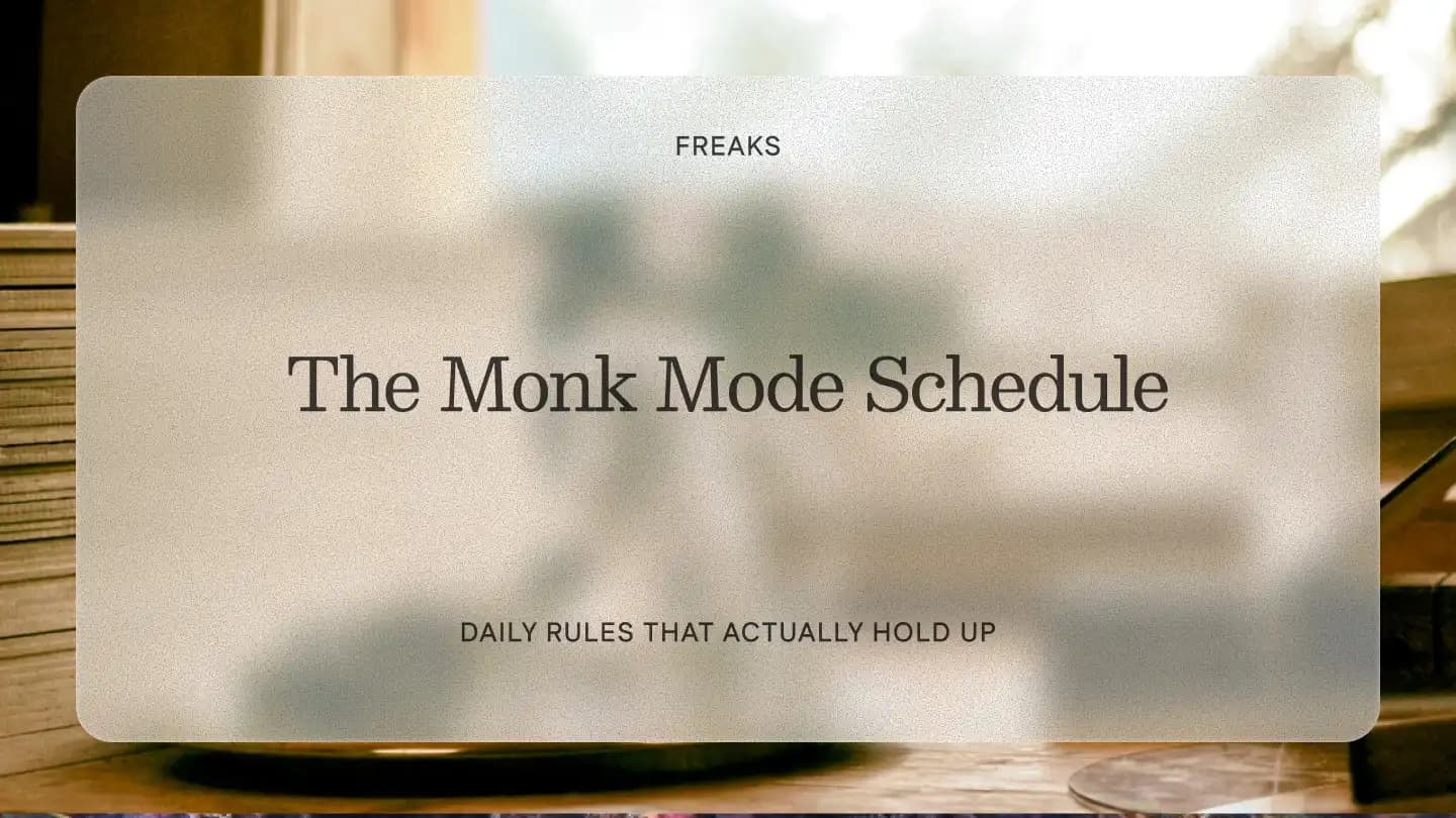 Freaks article title card reading 'The Monk Mode Schedule', with the subtitle 'Daily rules that actually hold up', over a warm interior with books by a window