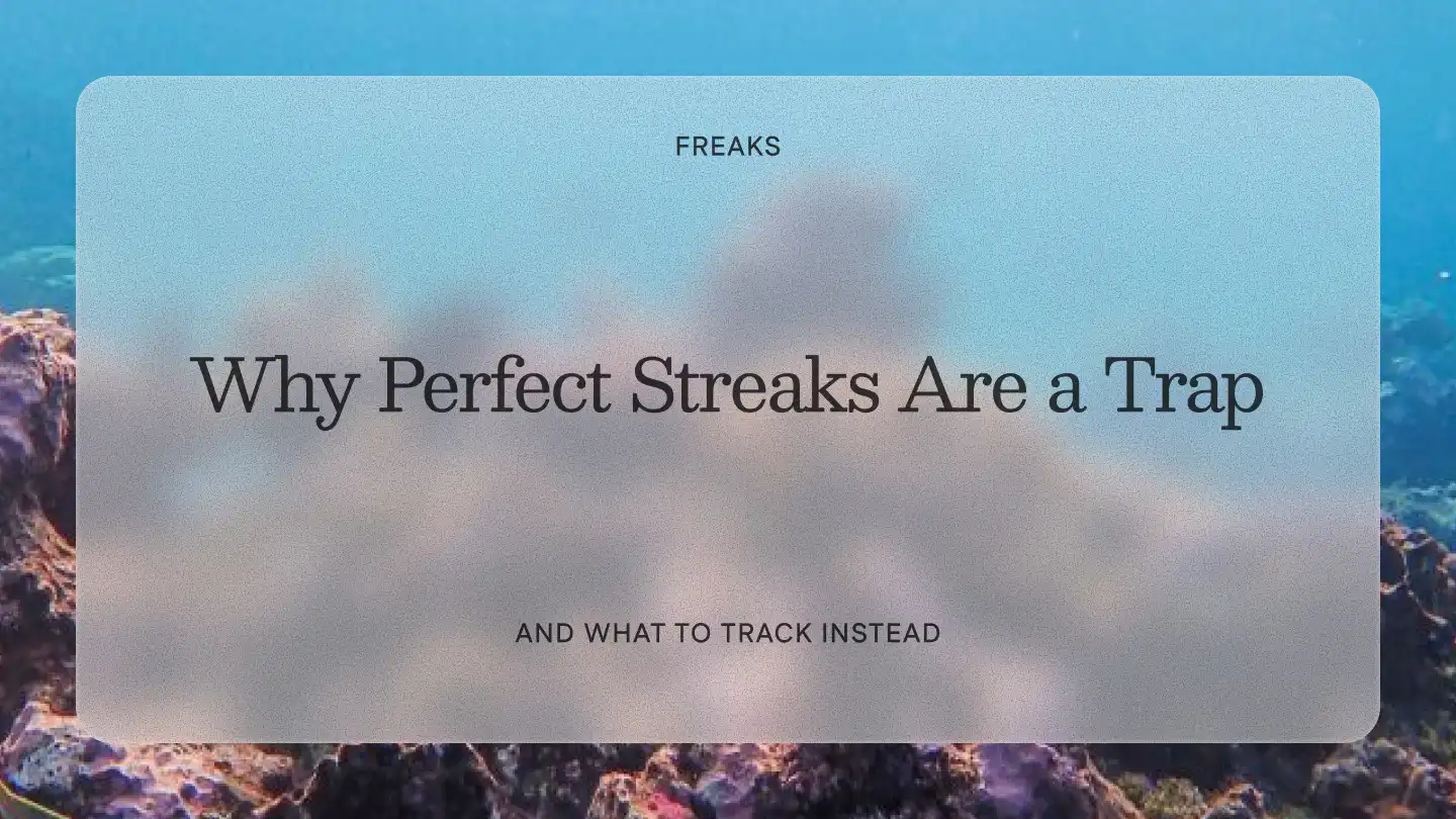 Freaks article title card reading 'Why Perfect Streaks Are a Trap', with the subtitle 'And what to track instead', over a blue underwater coral reef