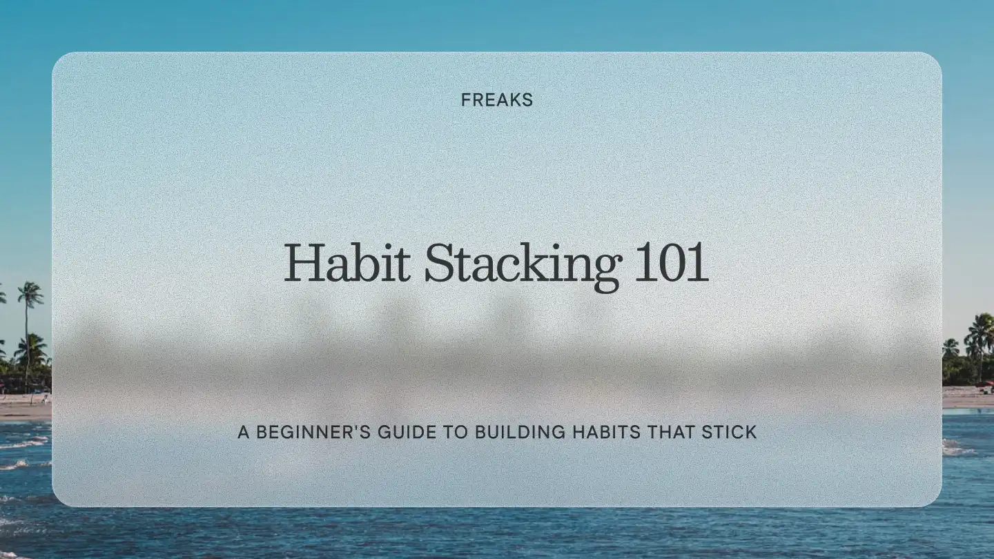 Freaks article title card reading 'Habit Stacking 101', with the subtitle 'A beginner's guide to building habits that stick', over a soft beach and ocean